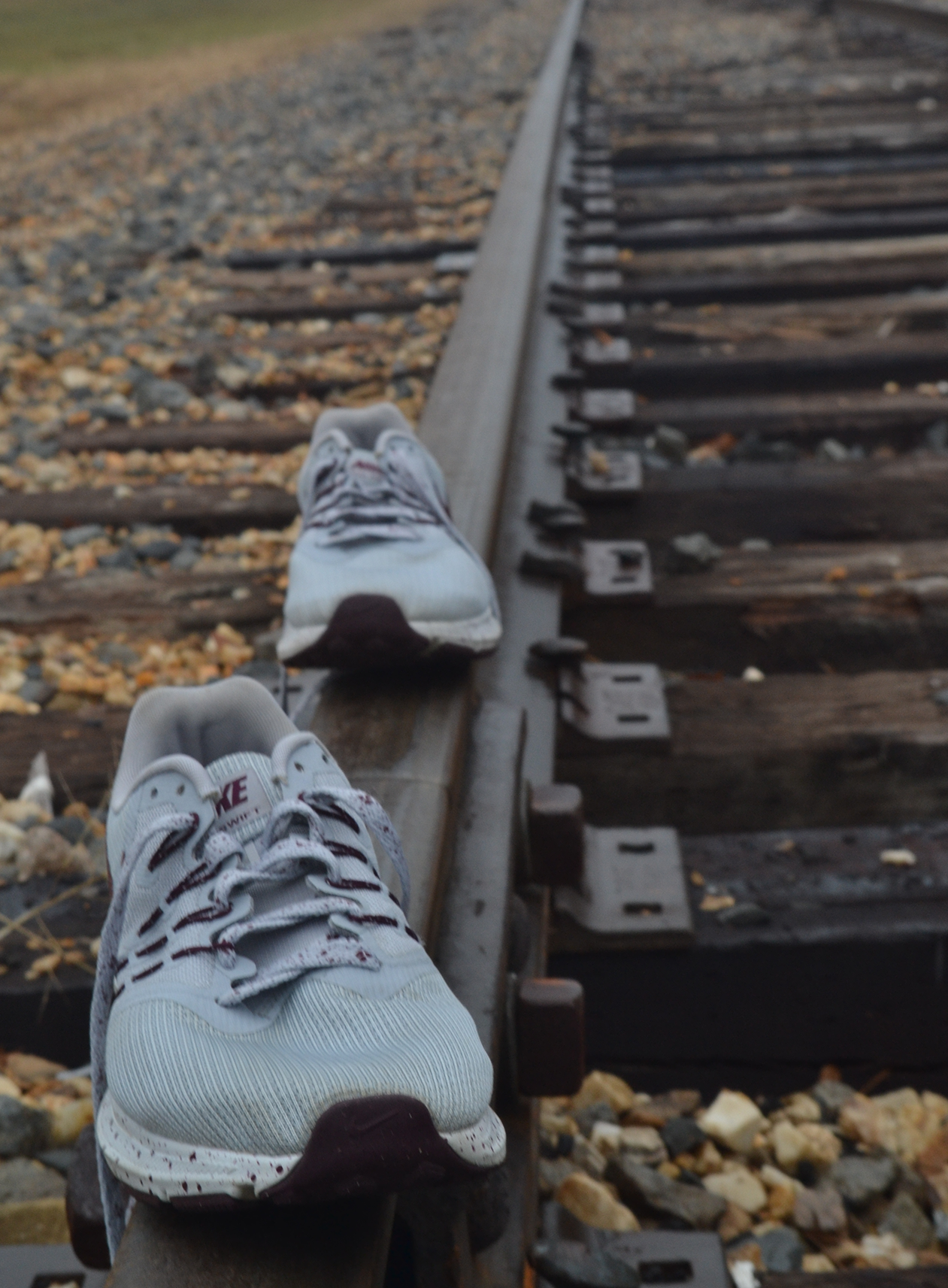 shoes on a train track